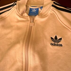 Pink and black Adidas zip up jacket gently used.